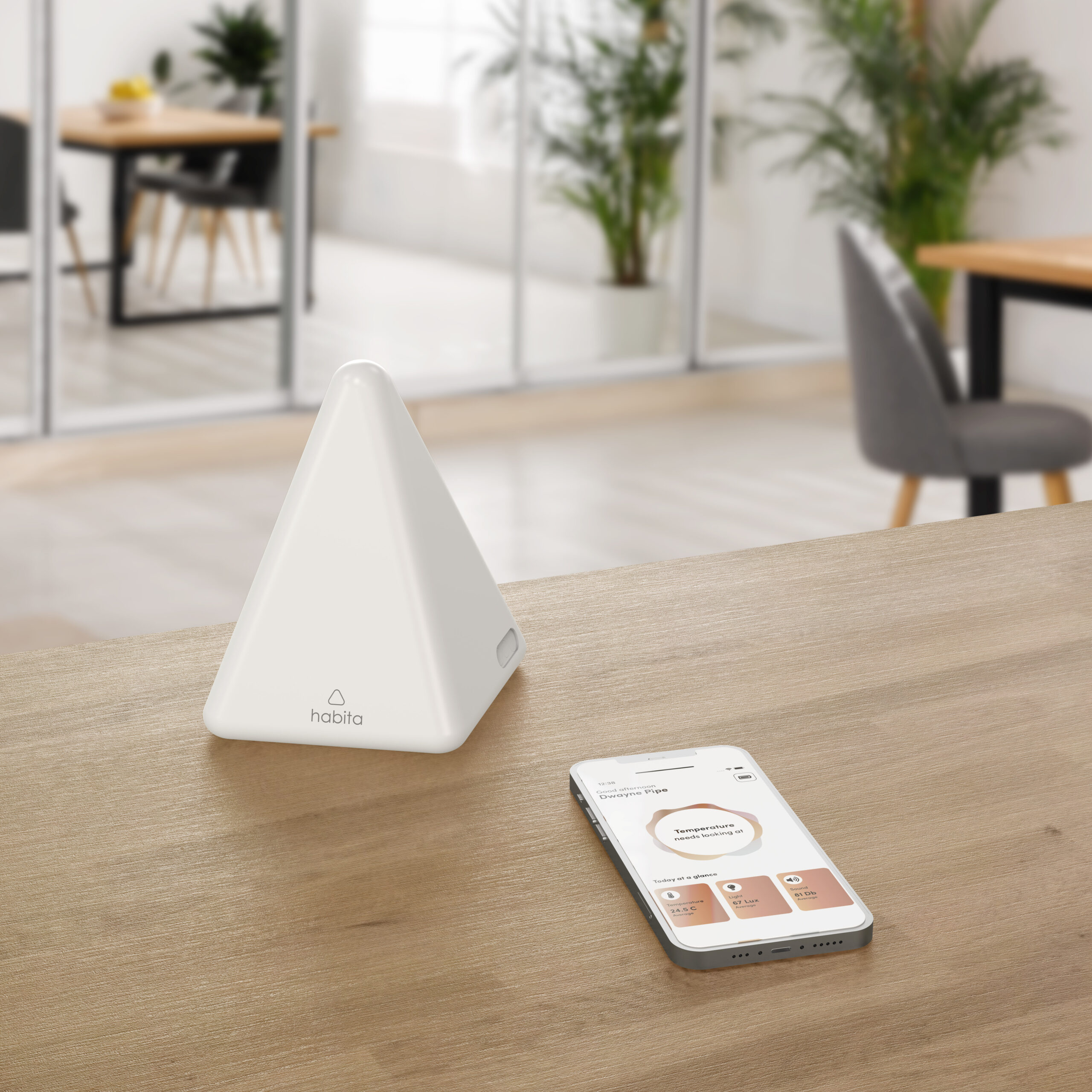 Habita device and mobile phone showing habita software on a table Habita device and mobile phone showing habita software on a table